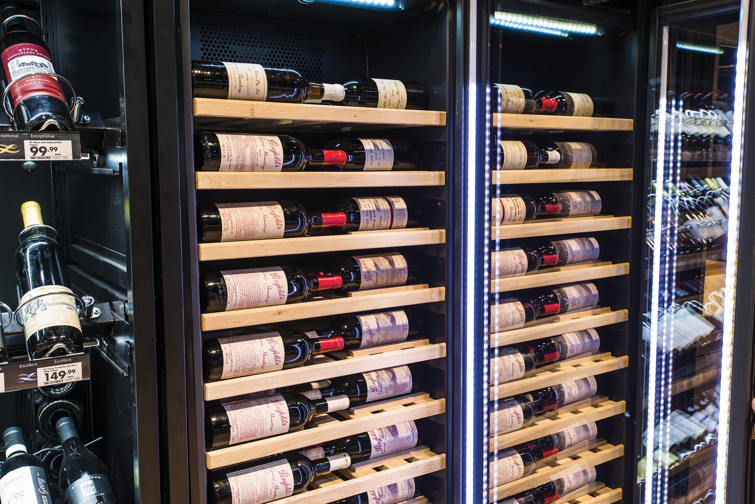 Vintec Wine Cabinets were configured with specially designed wooden shelves to lay bottles with labels facing and parallel to the glass doors to optimize visibility and accessibility.